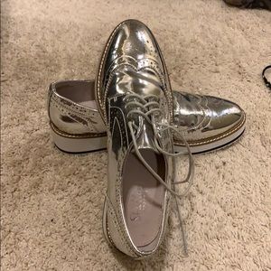 Shelly’s London silver platform loafers